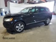✅ 2013 Volkswagen Touareg Exec • VIN: WVGEF9BP6DD007788 • Lot: 54606555. Listed on Copart with 167,879 mi. Free auction sales archive from the USA and detailed vehicle history report at DreamBid. Image 1.