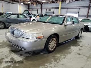 ✅ 2003 Lincoln Town Car Executive • VIN: 1LNHM81WX3Y696831 • Lot: 70990494. Listed on Copart with Not provided. Free auction sales archive from the USA and detailed vehicle history report at DreamBid. Image 1.
