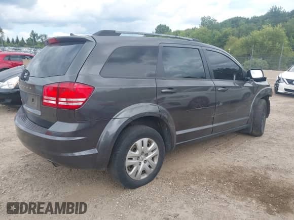 2017 Dodge Journey SE with VIN 3C4PDCAB2HT636910, listed as a IAAI auction lot 43095502 with 173,852 mi miles and . Bid and sale history available at DreamBid. Image 4.