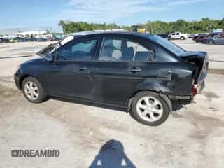 2008 Hyundai Accent GLS z VIN KMHCN46C08U184833, wystawiony jako Copart lot #60647344 z przebiegiem 129 037 mil mil oraz Szkoda całkowita • Salvage title. Historia ofert i sprzedaży dostępna na DreamBid. Obrazek 2.