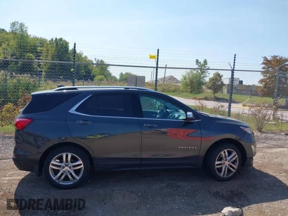 2018 Chevrolet Equinox Premier z VIN 3GNAXWEX1JS504549, wystawiony jako IAAI lot #43256484 z przebiegiem 64 262 mil mil oraz . Historia ofert i sprzedaży dostępna na DreamBid. Obrazek 13.