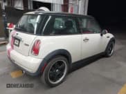 ✅ 2006 MINI Hardtop • VIN: WMWRC33506TK15034 • Lot: 42349957. Listed on IAAI with 153,596 mi. Free auction sales archive from the USA and detailed vehicle history report at DreamBid. Image 4.