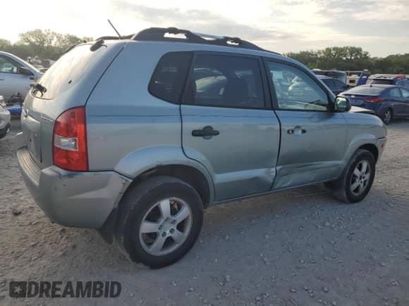 2006 Hyundai Tucson GL with VIN KM8JM12B86U411849, listed as a Copart auction lot 69301264 with 125,056 mi miles and Salvage title. Bid and sale history available at DreamBid. Image 3.