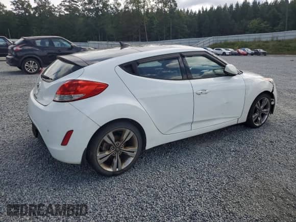 2013 Hyundai Veloster w/Gray Int z VIN KMHTC6AD6DU124843, wystawiony jako Copart lot #73250424 z przebiegiem 113 770 mil mil oraz Czysty tytuł • Clean title. Historia ofert i sprzedaży dostępna na DreamBid. Obrazek 3.