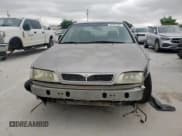 ✅ 1999 Infiniti G20 • VIN: JNKCP11A8XT014502 • Lot: 60660505. Wystawiony na Copart z przebiegiem 342 650 mil. Bezpłatny archiwum sprzedaży aukcyjnych z USA i szczegółowy raport historii pojazdu na DreamBid. Zdjęcie 5.