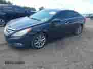 2013 Hyundai Sonata SE with VIN 5NPEC4AC7DH703326, listed as a IAAI auction lot 43168887 with 191,787 mi miles and . Bid and sale history available at DreamBid. Image 2.