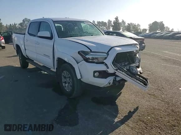 ✅ 2018 Toyota Tacoma SR5 • VIN: 5TFAZ5CN6JX067676 • Лот: 91860595. Опубликован ранее на Copart с пробегом 103 415 миль. Бесплатный доступ к архиву аукционных продаж из США и подробный отчёт об истории автомобиля на DreamBid. Изображение 14.
