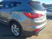 2015 Hyundai Santa Fe z VIN 5XYZWDLA9FG240216, wystawiony jako IAAI lot #43616955 z przebiegiem 203 691 mil mil oraz . Historia ofert i sprzedaży dostępna na DreamBid. Obrazek 6.