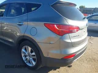 2015 Hyundai Santa Fe z VIN 5XYZWDLA9FG240216, wystawiony jako IAAI lot #43616955 z przebiegiem 203 691 mil mil oraz . Historia ofert i sprzedaży dostępna na DreamBid. Obrazek 6.