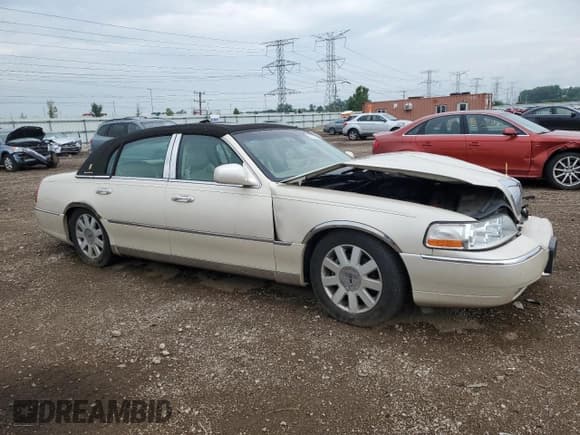 ✅ 2003 Lincoln Town Car Cartier • VIN: 1LNHM83W73Y631786 • Lot: 63332225. Listed on Copart with 163,204 mi. Free auction sales archive from the USA and detailed vehicle history report at DreamBid. Image 4.