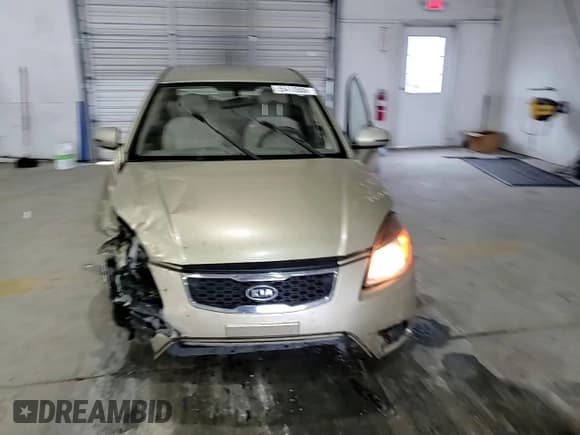 ✅ 2011 Kia Rio LX • VIN: KNADH4A37B6943512 • Лот: 85410505. Опубликован ранее на Copart с пробегом 138 943 миль. Бесплатный доступ к архиву аукционных продаж из США и подробный отчёт об истории автомобиля на DreamBid. Изображение 13.