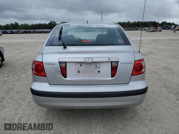 2005 Hyundai Elantra GLS z VIN KMHDN56D65U136462, wystawiony jako Copart lot #79910974 z przebiegiem 146 142 mil mil oraz Czysty tytuł • Clean title. Historia ofert i sprzedaży dostępna na DreamBid. Obrazek 6.