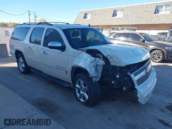 ✅ 2014 Chevrolet Suburban LTZ • VIN: 1GNSKKE7XER142130 • Lot: 43595884. Listed on IAAI with 165,414 mi. Free auction sales archive from the USA and detailed vehicle history report at DreamBid. Image 1.