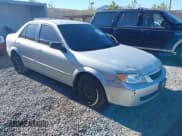 ✅ 2001 Mazda Protege LX • VIN: JM1BJ226910401437 • Lot: 43548017. Wystawiony na IAAI z przebiegiem 236 866 mil. Bezpłatny archiwum sprzedaży aukcyjnych z USA i szczegółowy raport historii pojazdu na DreamBid. Zdjęcie 1.