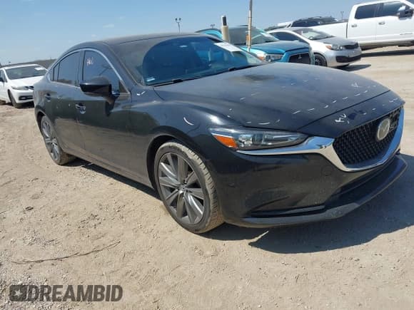 ✅ 2021 Mazda 6 Touring • VIN: JM1GL1VM8M1605049 • Lot: 43335618. Listed on IAAI with 101,015 mi. Free auction sales archive from the USA and detailed vehicle history report at DreamBid. Image 1.