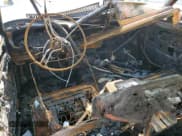 ✅ 1987 Jeep Grand Wagoneer • VIN: 1JCNJ15U9HT036749 • Lot: 51932115. Wystawiony na Copart z przebiegiem Nie podano. Bezpłatny archiwum sprzedaży aukcyjnych z USA i szczegółowy raport historii pojazdu na DreamBid. Zdjęcie 8.