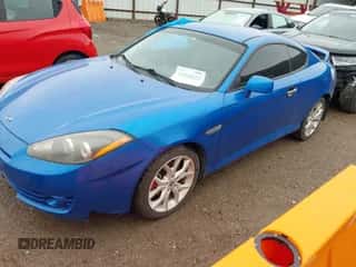 2008 Hyundai Tiburon GT z VIN KMHHN66FX8U282926, wystawiony jako IAAI lot #41959023 z przebiegiem 119 414 mil mil oraz . Historia ofert i sprzedaży dostępna na DreamBid. Obrazek 2.