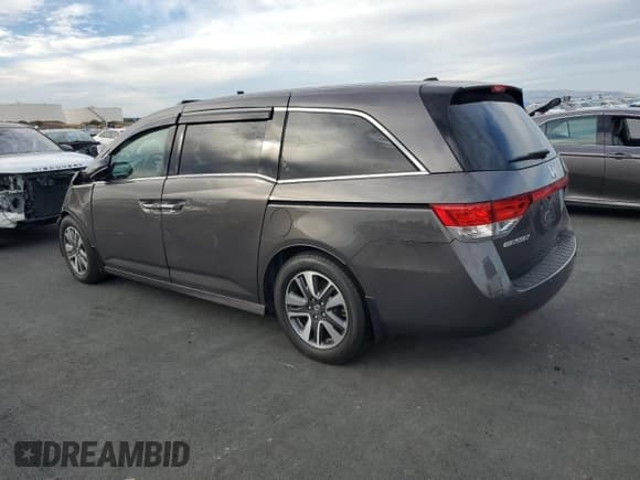✅ 2016 Honda Odyssey Touring Elite • VIN: 5FNRL5H90GB040623 • Lot: 92664135. Listed on Copart with 126,235 mi. Free auction sales archive from the USA and detailed vehicle history report at DreamBid. Image 2.