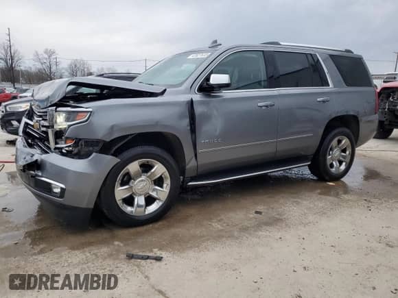 2020 Chevrolet Tahoe Premier with VIN 1GNSKCKC4LR106373, listed as a Copart auction lot 47627615 with 100,511 mi miles and Salvage title. Bid and sale history available at DreamBid. Image 1.