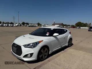 ✅ 2015 Hyundai Veloster Turbo • VIN: KMHTC6AE1FU230029 • Lot: 74982304. Listed on Copart with 121,447 mi. Free auction sales archive from the USA and detailed vehicle history report at DreamBid. Image 2.