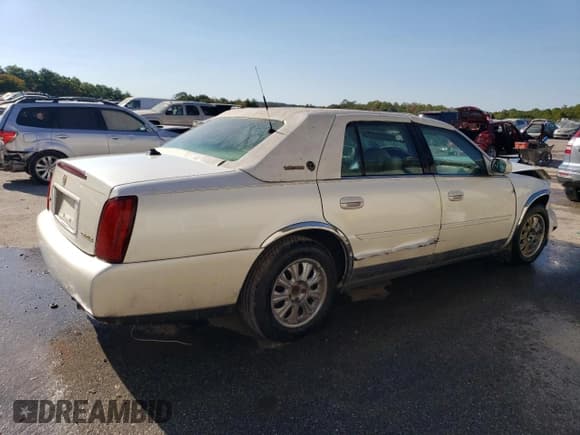 ✅ 2003 Cadillac DeVille • VIN: 1G6KD54Y63U278279 • Lot: 75392814. Listed on Copart with 106,130 mi. Free auction sales archive from the USA and detailed vehicle history report at DreamBid. Image 3.
