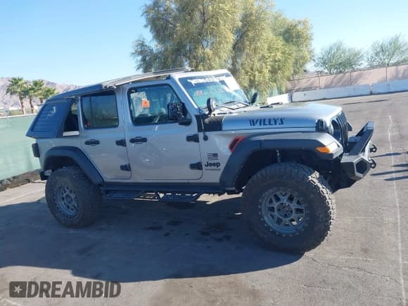 ✅ 2021 Jeep Wrangler Unlimited Sport S • VIN: 1C4HJXDG4MW711834 • Lot: 43638306. Wystawiony na IAAI z przebiegiem 51 789 mil. Bezpłatny archiwum sprzedaży aukcyjnych z USA i szczegółowy raport historii pojazdu na DreamBid. Zdjęcie 13.