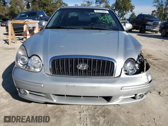 2003 Hyundai Sonata с VIN KMHWF25S33A905177, выставлен на аукционе Copart как лот 87513005 с пробегом 82 416 миль миль и Списание • Salvage title. История ставок и продаж доступна на DreamBid. Изображение 5.