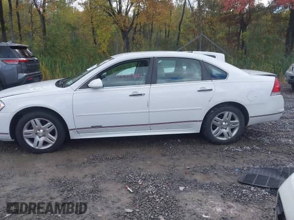 2016 Chevrolet Impala LT with VIN 2G1WB5E3XG1127706, listed as a IAAI auction lot 43407642 with 145,236 mi miles and . Bid and sale history available at DreamBid. Image 14.