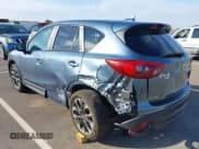 ✅ 2016 Mazda CX-5 Grand Touring • VIN: JM3KE4DY4G0916411 • Lot: 43258525. Wystawiony na IAAI z przebiegiem 48 743 mil. Bezpłatny archiwum sprzedaży aukcyjnych z USA i szczegółowy raport historii pojazdu na DreamBid. Zdjęcie 3.