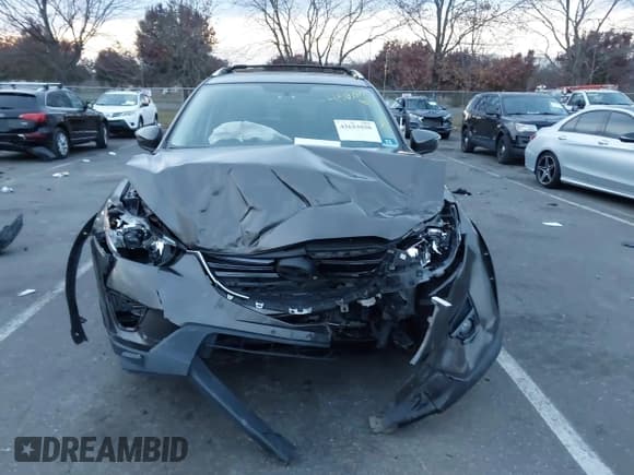 ✅ 2016 Mazda CX-5 Touring • VIN: JM3KE4CY5G0845575 • Lot: 43653030. Listed on IAAI with 79,795 mi. Free auction sales archive from the USA and detailed vehicle history report at DreamBid. Image 12.