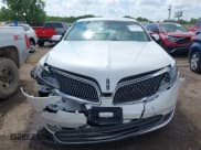 ✅ 2014 Lincoln MKS • VIN: 1LNHL9DK7EG601720 • Lot: 42464979. Listed on IAAI with 58,163 mi. Free auction sales archive from the USA and detailed vehicle history report at DreamBid. Image 12.