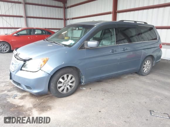 ✅ 2010 Honda Odyssey EX-L • VIN: 5FNRL3H60AB016923 • Lot: 43277237. Listed on IAAI with 166,257 mi. Free auction sales archive from the USA and detailed vehicle history report at DreamBid. Image 2.