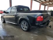 ✅ 2003 Ford F-150 Harley-Davidson • VIN: 1FTRW07383KD63595 • Lot: 59922725. Listed on Copart with 130,837 mi. Free auction sales archive from the USA and detailed vehicle history report at DreamBid. Image 2.