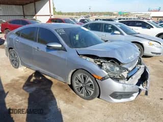 ✅ 2017 Honda Civic EX-T • VIN: 19XFC1F30HE005016 • Lot: 43641188. Listed on IAAI with 124,195 mi. Free auction sales archive from the USA and detailed vehicle history report at DreamBid. Image 1.