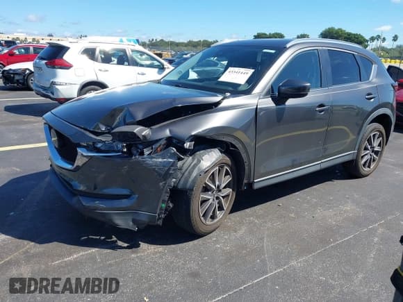 ✅ 2018 Mazda CX-5 Touring • VIN: JM3KFACM5J1349573 • Lot: 43341449. Listed on IAAI with 45,527 mi. Free auction sales archive from the USA and detailed vehicle history report at DreamBid. Image 2.