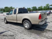 ✅ 1999 Ford F-150 • VIN: 1FTRX17W1XNB82405 • Lot: 59284925. Listed on Copart with 207,345 mi. Free auction sales archive from the USA and detailed vehicle history report at DreamBid. Image 2.