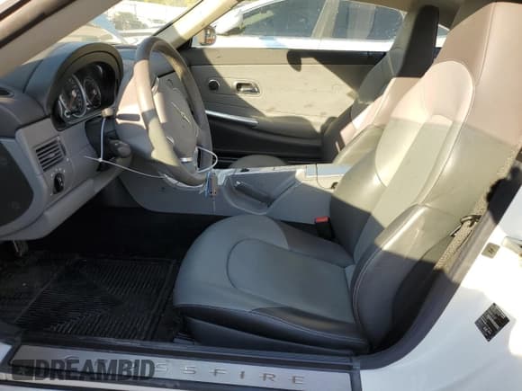 ✅ 2004 Chrysler Crossfire • VIN: 1C3AN69L94X002966 • Lot: 76795154. Listed on Copart with 14,235 mi. Free auction sales archive from the USA and detailed vehicle history report at DreamBid. Image 7.