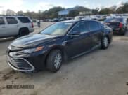 ✅ 2021 Toyota Camry Hybrid LE • VIN: 4T1C31AK0MU562775 • Лот: 92067265. Опубликован ранее на Copart с пробегом 92 294 миль. Бесплатный доступ к архиву аукционных продаж из США и подробный отчёт об истории автомобиля на DreamBid. Изображение 1.
