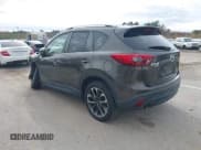 ✅ 2016 Mazda CX-5 Grand Touring • VIN: JM3KE4DY6G0672342 • Lot: 43581193. Wystawiony na IAAI z przebiegiem 94 680 mil. Bezpłatny archiwum sprzedaży aukcyjnych z USA i szczegółowy raport historii pojazdu na DreamBid. Zdjęcie 3.