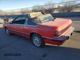 ✅ 1989 Chrysler LeBaron • VIN: 1C3XJ45K0KG251502 • Lot: 87112404. Wystawiony na Copart z przebiegiem 166 445 mil. Bezpłatny archiwum sprzedaży aukcyjnych z USA i szczegółowy raport historii pojazdu na DreamBid. Zdjęcie 2.