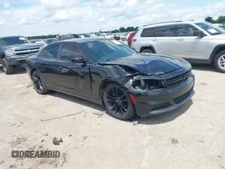 ✅ 2018 Dodge Charger SXT • VIN: 2C3CDXBG8JH185159 • Lot: 42735397. Listed on IAAI with 165,781 mi. Free auction sales archive from the USA and detailed vehicle history report at DreamBid. Image 1.