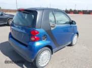 ✅ 2009 Smart fortwo Pure • VIN: WMEEJ31X49K309473 • Lot: 42714704. Listed on IAAI with 30,176 mi. Free auction sales archive from the USA and detailed vehicle history report at DreamBid. Image 4.