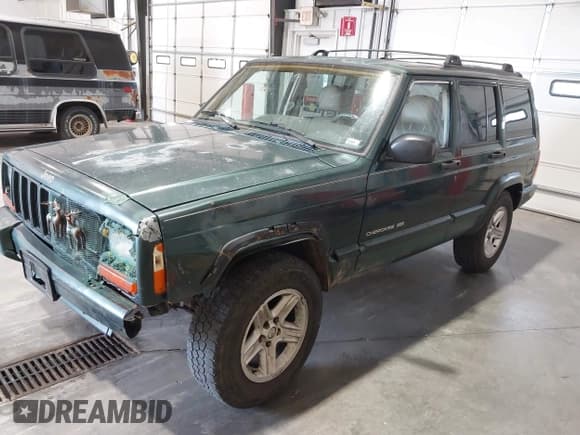 ✅ 2001 Jeep Cherokee Sport • VIN: 1J4FF58S51L579766 • Lot: 42623211. Listed on IAAI with 257,681 mi. Free auction sales archive from the USA and detailed vehicle history report at DreamBid. Image 2.