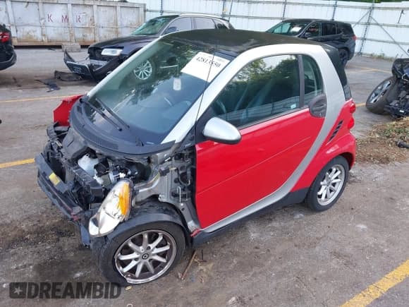 ✅ 2009 Smart fortwo Pure • VIN: WMEEJ31X19K237406 • Lot: 42813550. Listed on IAAI with 50,254 mi. Free auction sales archive from the USA and detailed vehicle history report at DreamBid. Image 2.