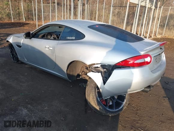 ✅ 2014 Jaguar XK XKR • VIN: SAJWA4DC7EMB52199 • Lot: 41191119. Listed on IAAI with 90,585 mi. Free auction sales archive from the USA and detailed vehicle history report at DreamBid. Image 3.