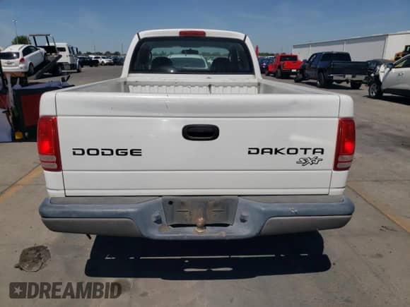 2004 Dodge Dakota z VIN 1D7GL12K44S653683, wystawiony jako Copart lot #69008954 z przebiegiem 135 546 mil mil oraz Szkoda całkowita • Salvage title. Historia ofert i sprzedaży dostępna na DreamBid. Obrazek 6.