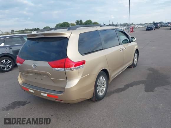 2011 Toyota Sienna XLE AAS with VIN 5TDYK3DC2BS122538, listed as a IAAI auction lot 43247955 with 238,815 mi miles and . Bid and sale history available at DreamBid. Image 4.