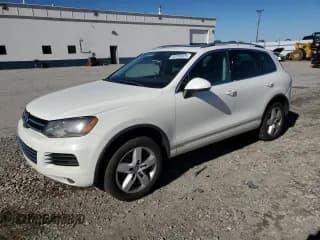 ✅ 2011 Volkswagen Touareg Sport • VIN: WVGFF9BP2BD007045 • Лот: 82288525. Опубликован ранее на Copart с пробегом 134 401 миль. Бесплатный доступ к архиву аукционных продаж из США и подробный отчёт об истории автомобиля на DreamBid. Изображение 1.