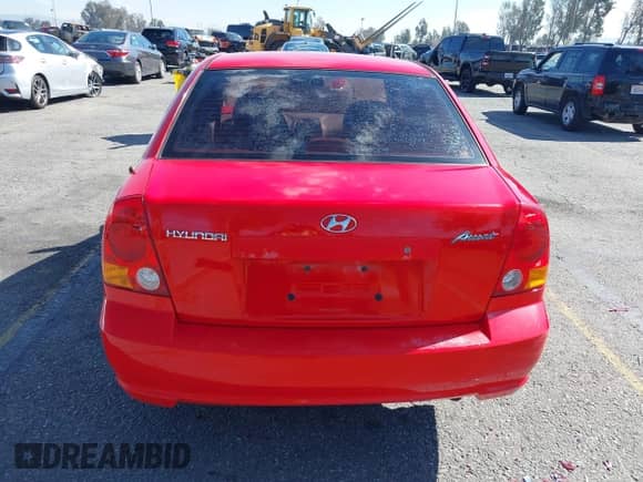 2003 Hyundai Accent GL z VIN KMHCG45C93U487209, wystawiony jako IAAI lot #41590636 z przebiegiem 118 811 mil mil oraz . Historia ofert i sprzedaży dostępna na DreamBid. Obrazek 16.