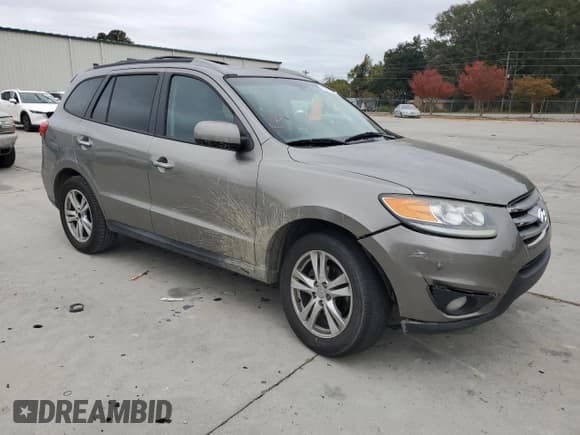 ✅ 2012 Hyundai Santa Fe Limited • VIN: 5XYZK3AB8CG143621 • Lot: 77982534. Listed on Copart with 130,010 mi. Free auction sales archive from the USA and detailed vehicle history report at DreamBid. Image 4.